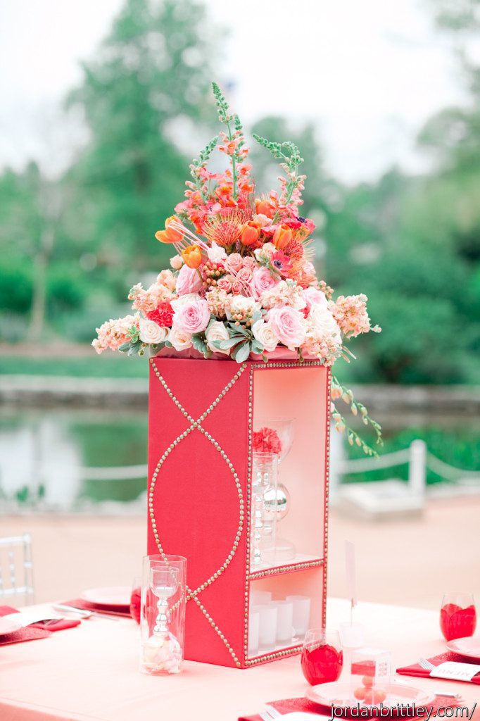Unique coral centerpiece on in red with silver nailhead trim in a pattern