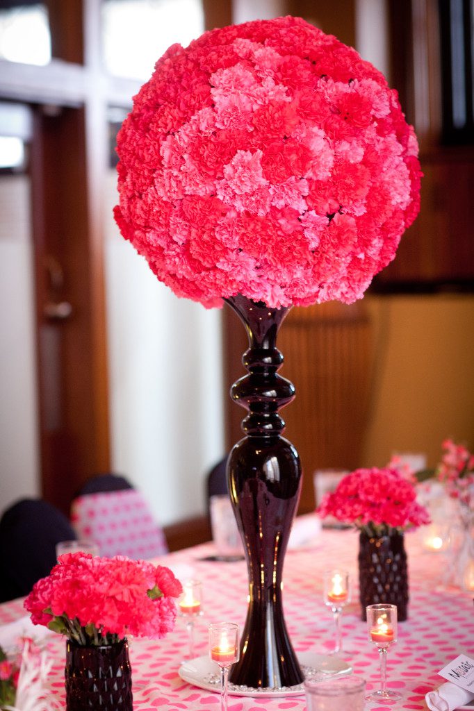 extra large carnation ball centerpiece hot pink on black tall vase