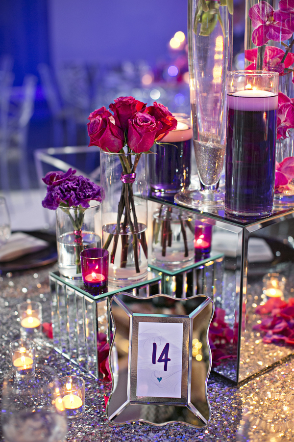 purple pink flowers on mirror boxes with mirror frame table number on silver sequin tablecloth linen