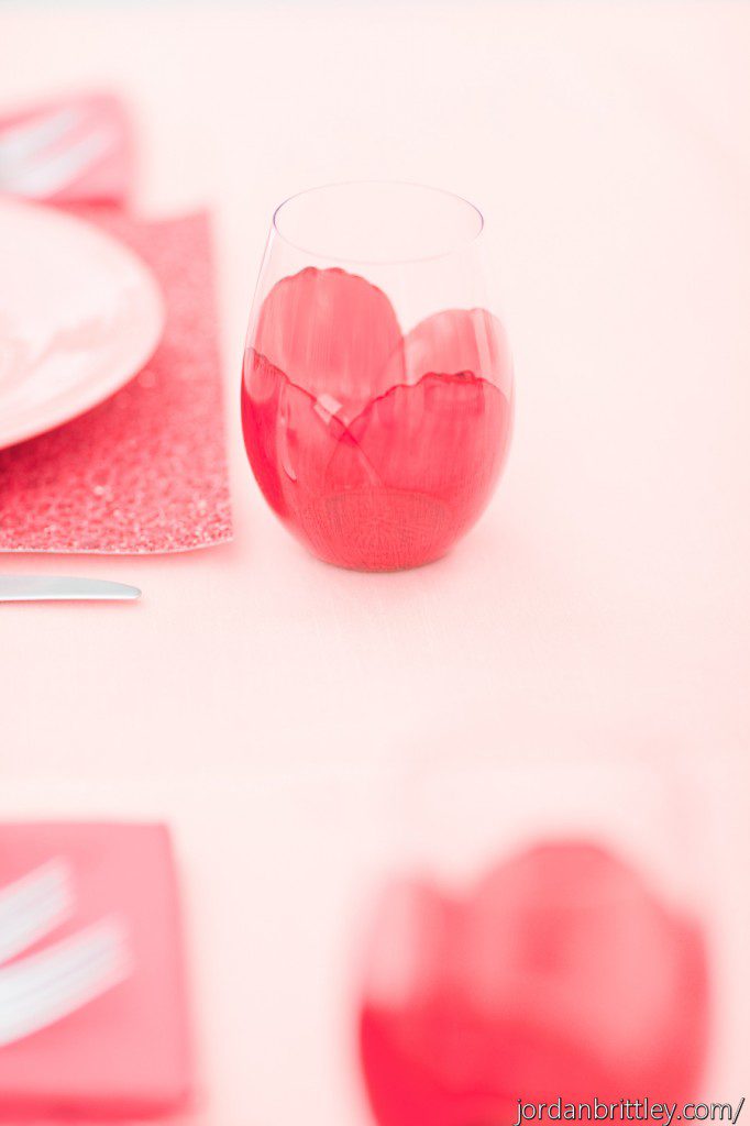 Painted red petal wine glasses glitter placemat peach tablecloth linen