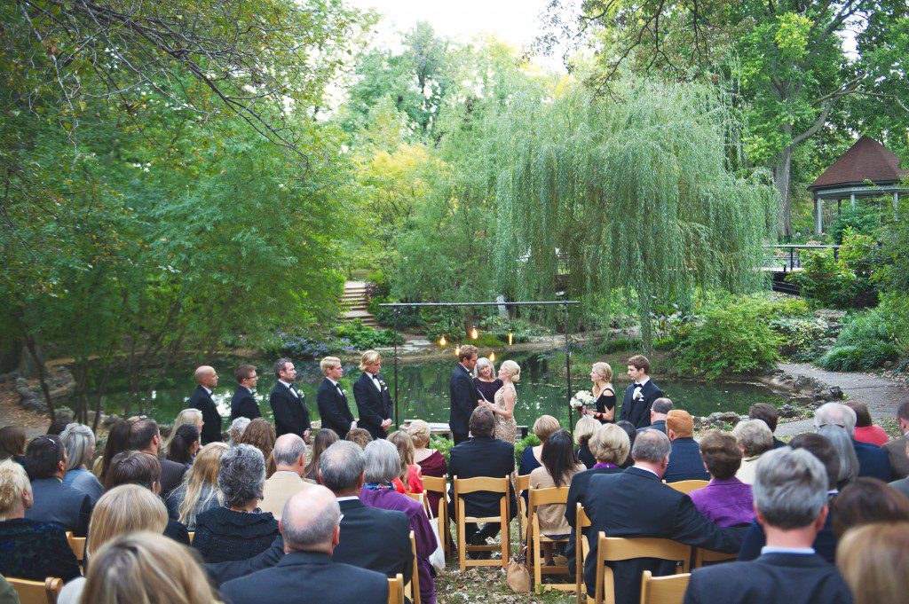 Wedding ceremony in a park willow tree