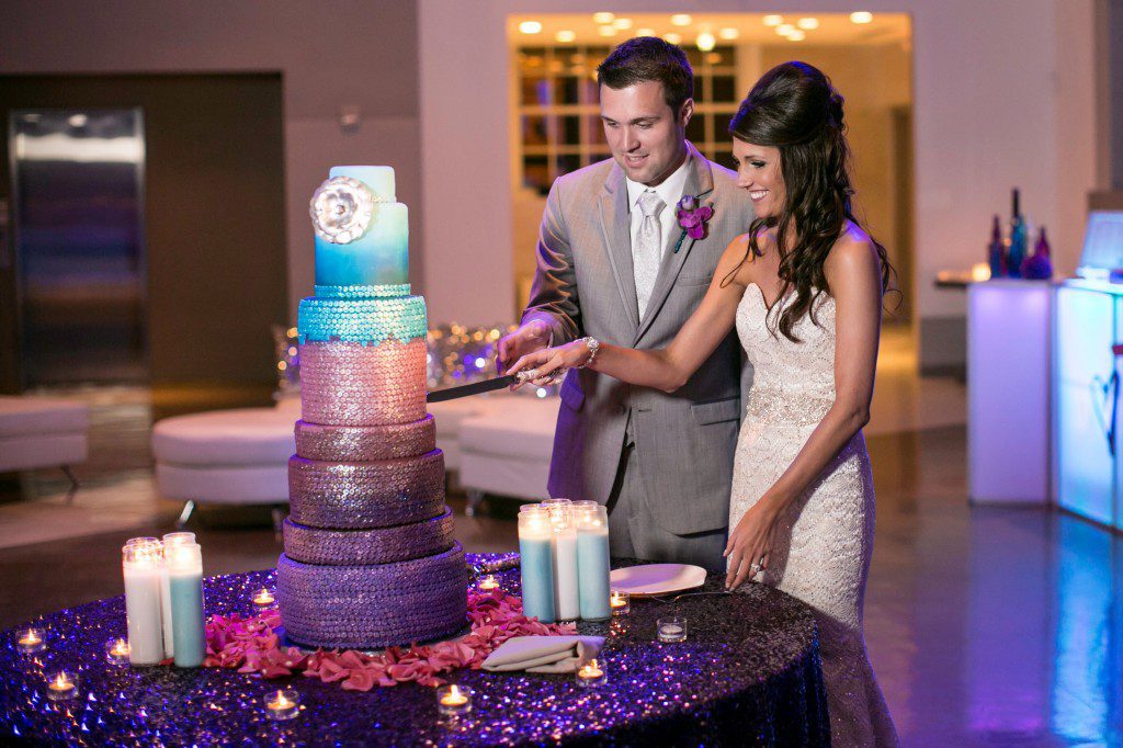 Bride and groom cutting sequin wedding cake purple turquoise