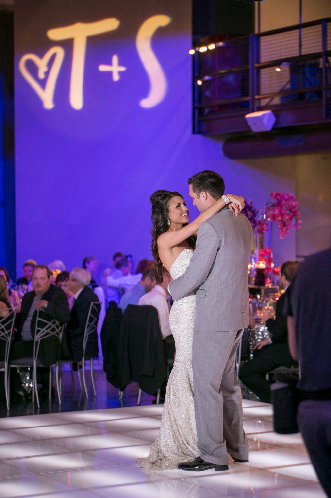 Bride and groom first dance acrylic glow dance floor with wedding monogram gobo