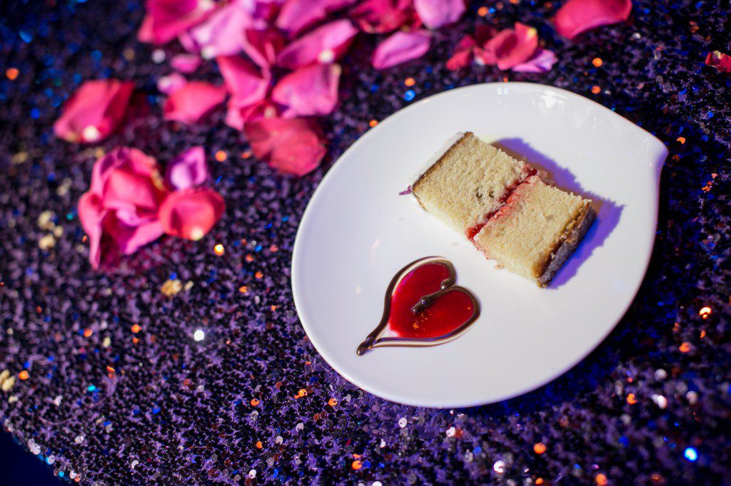 wedding cake pink sauce heart purple sequin tablecloth linen pink petals