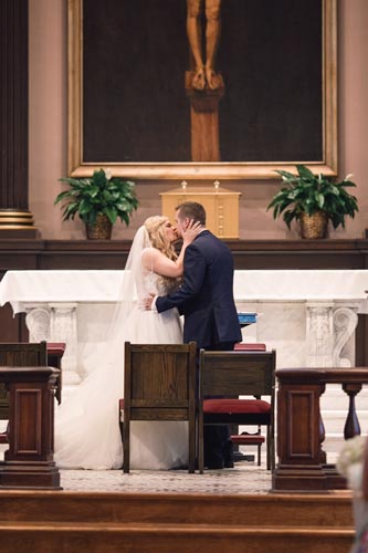 Bride & Groom Kiss at St. Louis Old Cathedral | St. Louis Weddings by Events Luxe